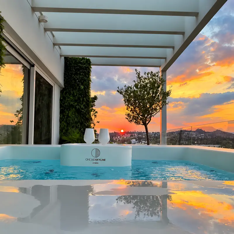 Golden sunset reflected in the water of a private terrace Jacuzzi
