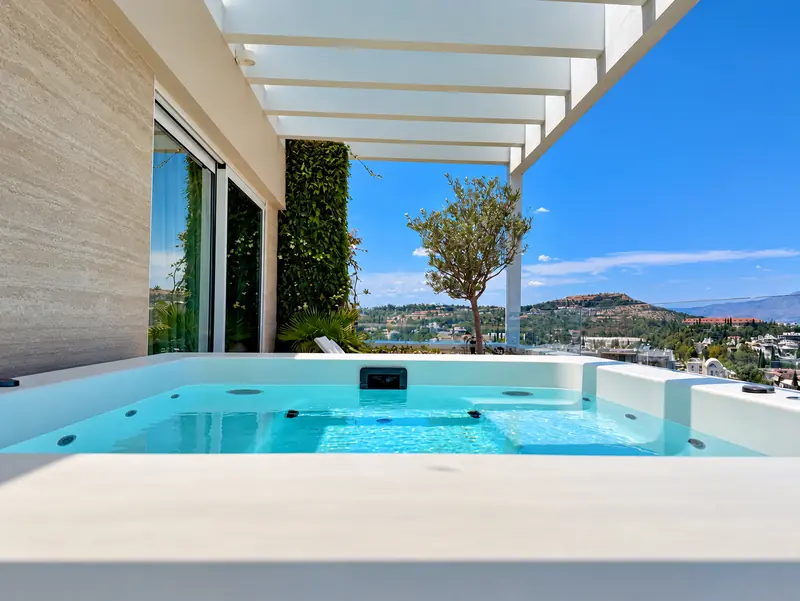 The Penthouse Residence terrace Jacuzzi with a panoramic view of Athens