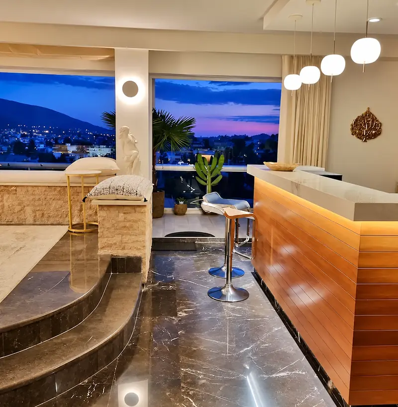 The Penthouse Suite with its sculptural marble interior and evening skyline